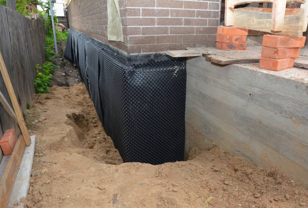 SJ Waterproofing Pros technician performing targeted Basement Waterproofing assessment in Columbus, KS